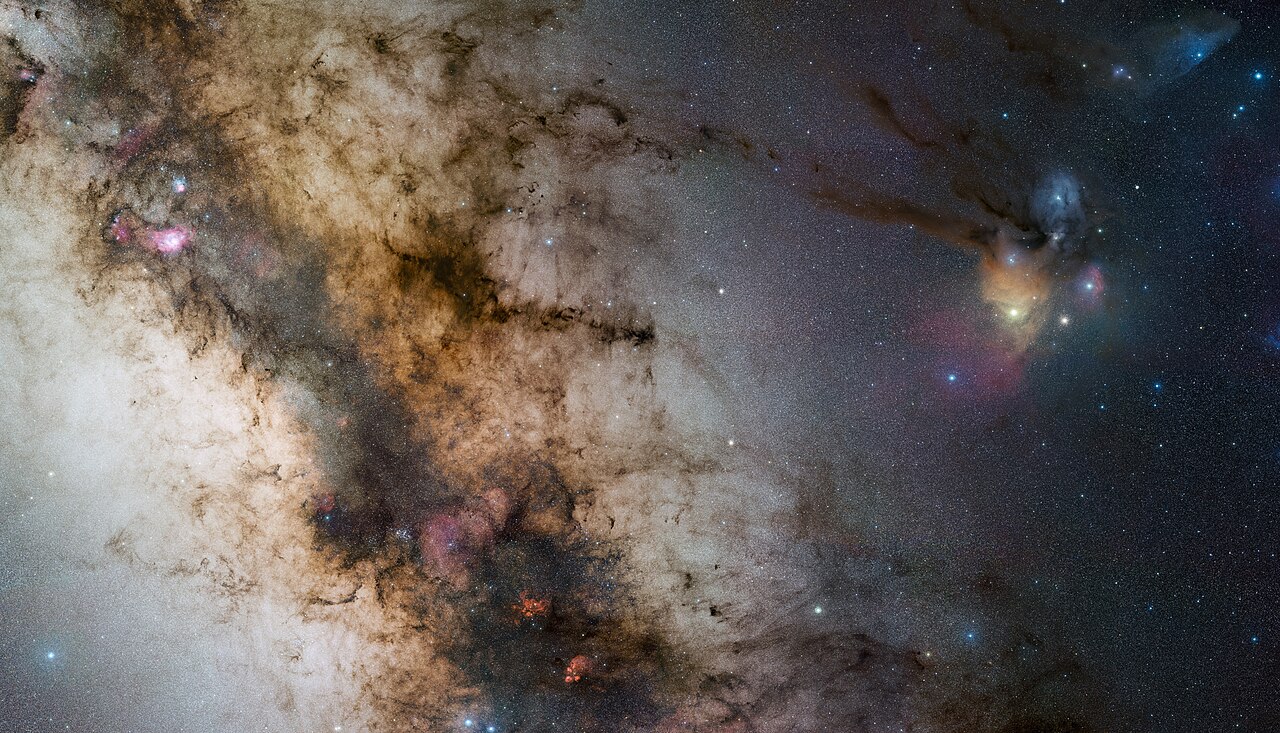 The bright core of the Milky Way in Sagittarius and Scorpius, with dark dust lanes and pink nebulae